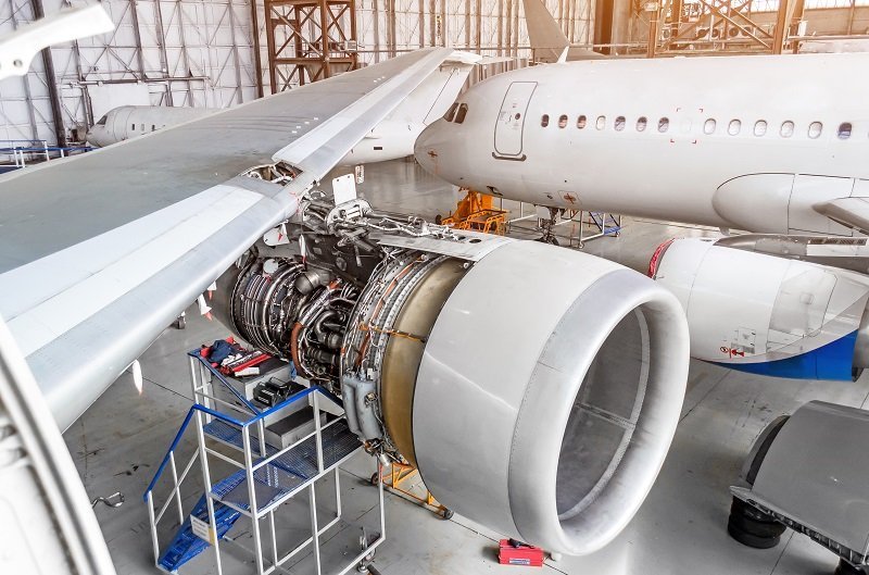 View Of The Wing And Engine Of The Aircraft Repair In The Hangar.