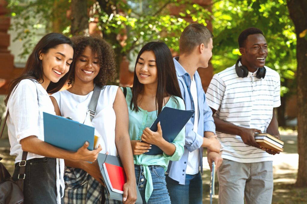 group,of,international,students,resting,in,campus,outdoors,during,break