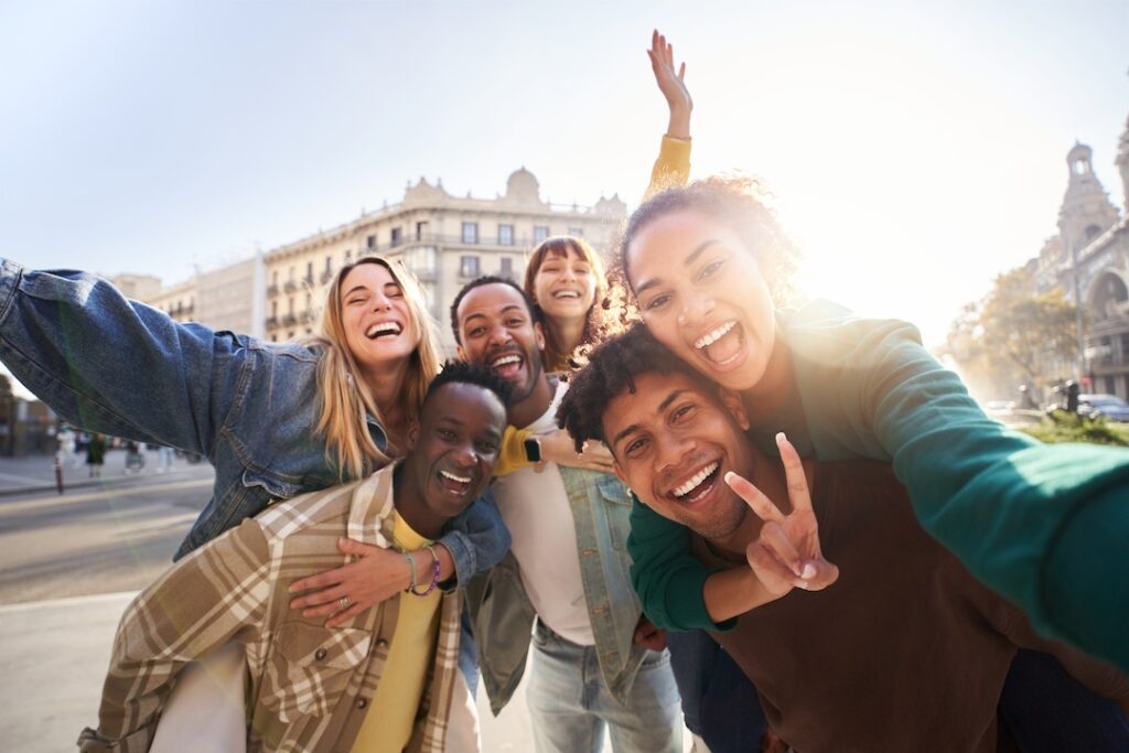 a group of cheerful students college friends taking a picture