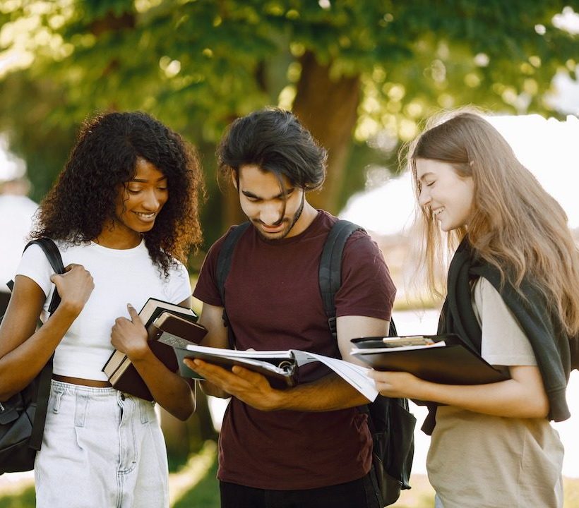 three international students standing in a park an 2022 06 09 15 30 41 utc (1)